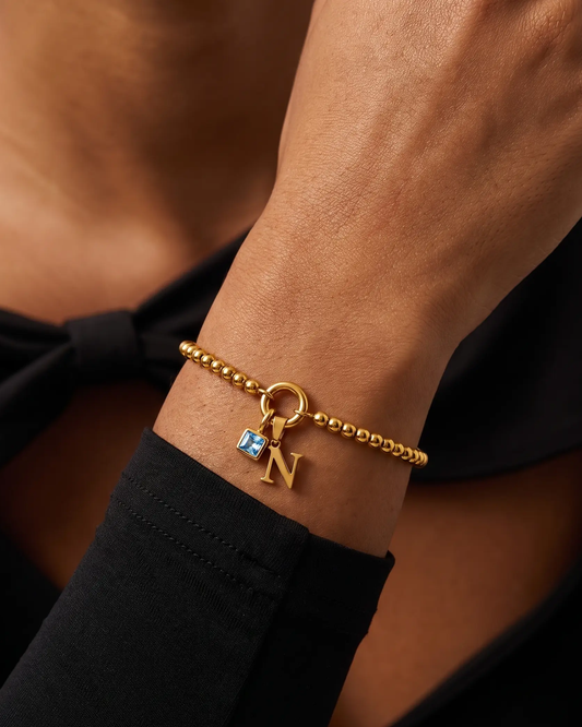 studio-ai bracelet-pebble-initial-birthstone-bracelet_studio2_a2+solo.png