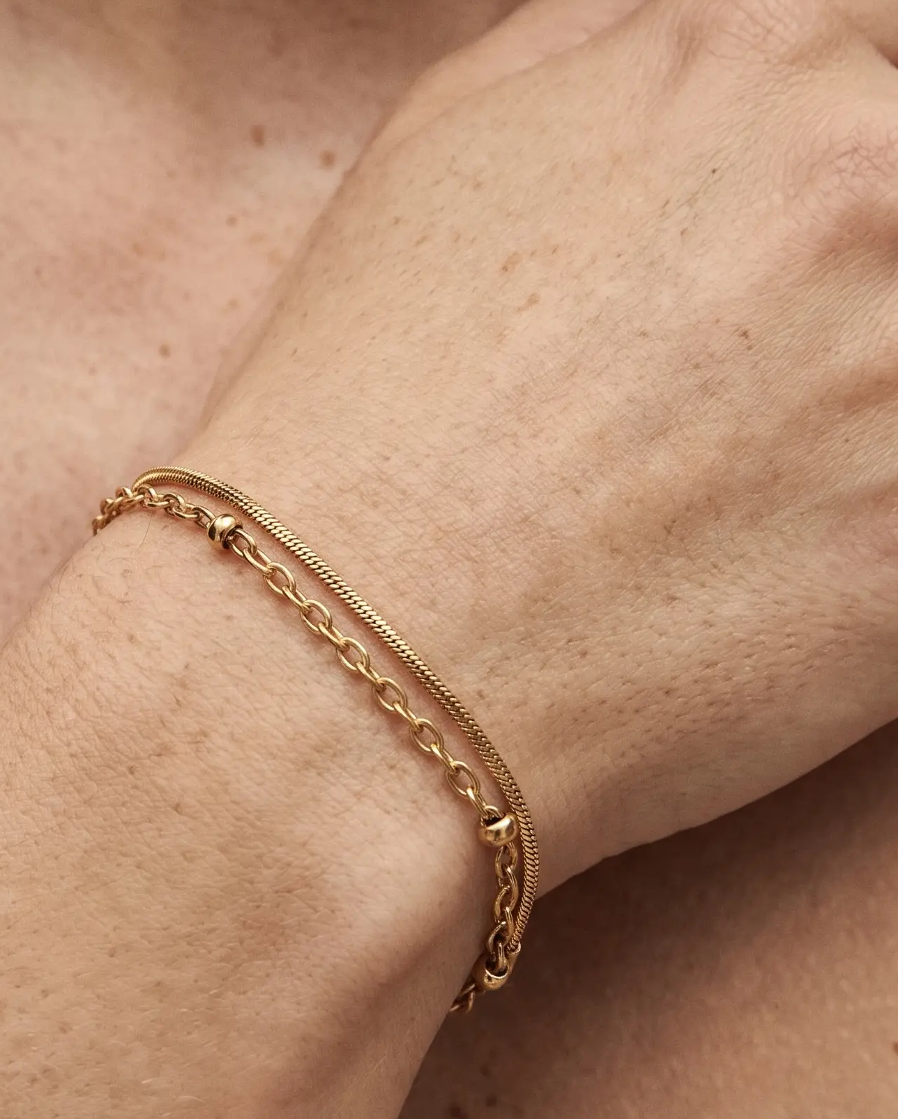 studio-ai bracelet-bead-and-snake-layered-bracelet_lifestyle1_a1+solo.png