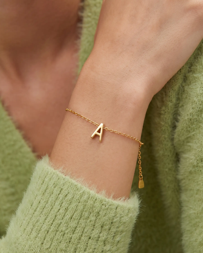 studio-ai bracelet-fine-initial-charm-bracelet_studio2_a1+solo.png