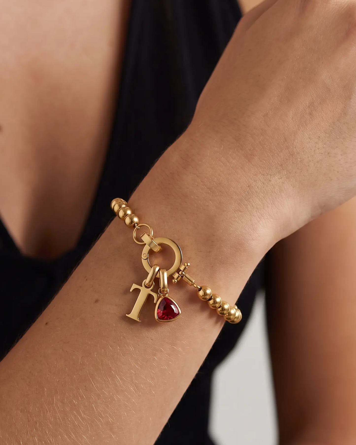 studio-ai bracelet-pebble-birthstone-initial-bracelet_studio2_a1+solo.png