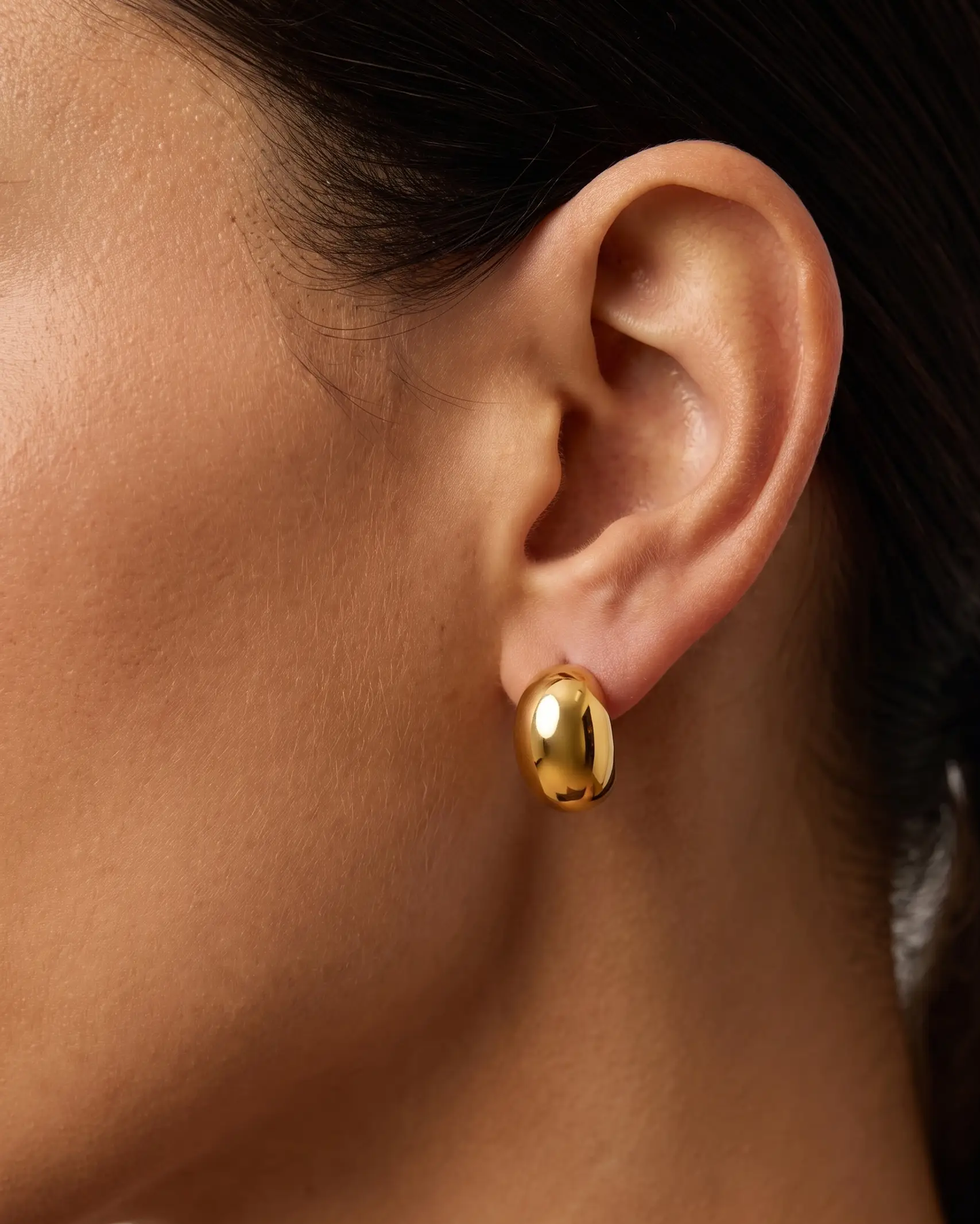 studio-ai earrings-elna-dome-studs_lifestyle1_a1+solo.png