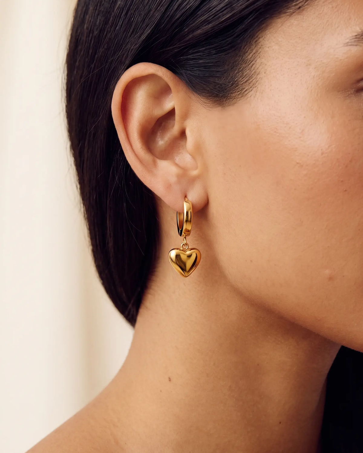 studio-ai earrings-puff-heart-drop-huggies_studio2_a1+solo.png