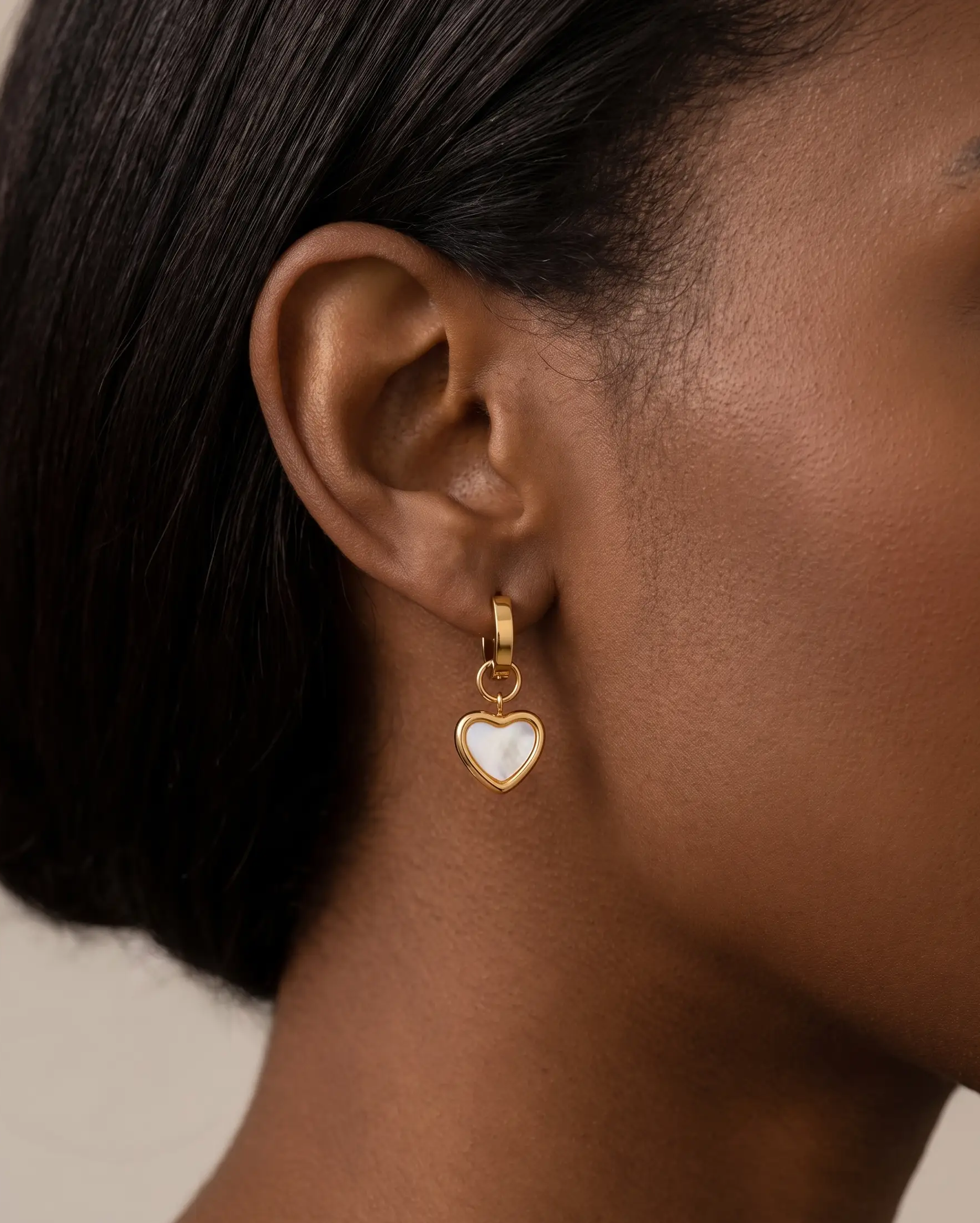 studio-ai earrings-selma-heart-huggies_lifestyle1_a2+solo.png