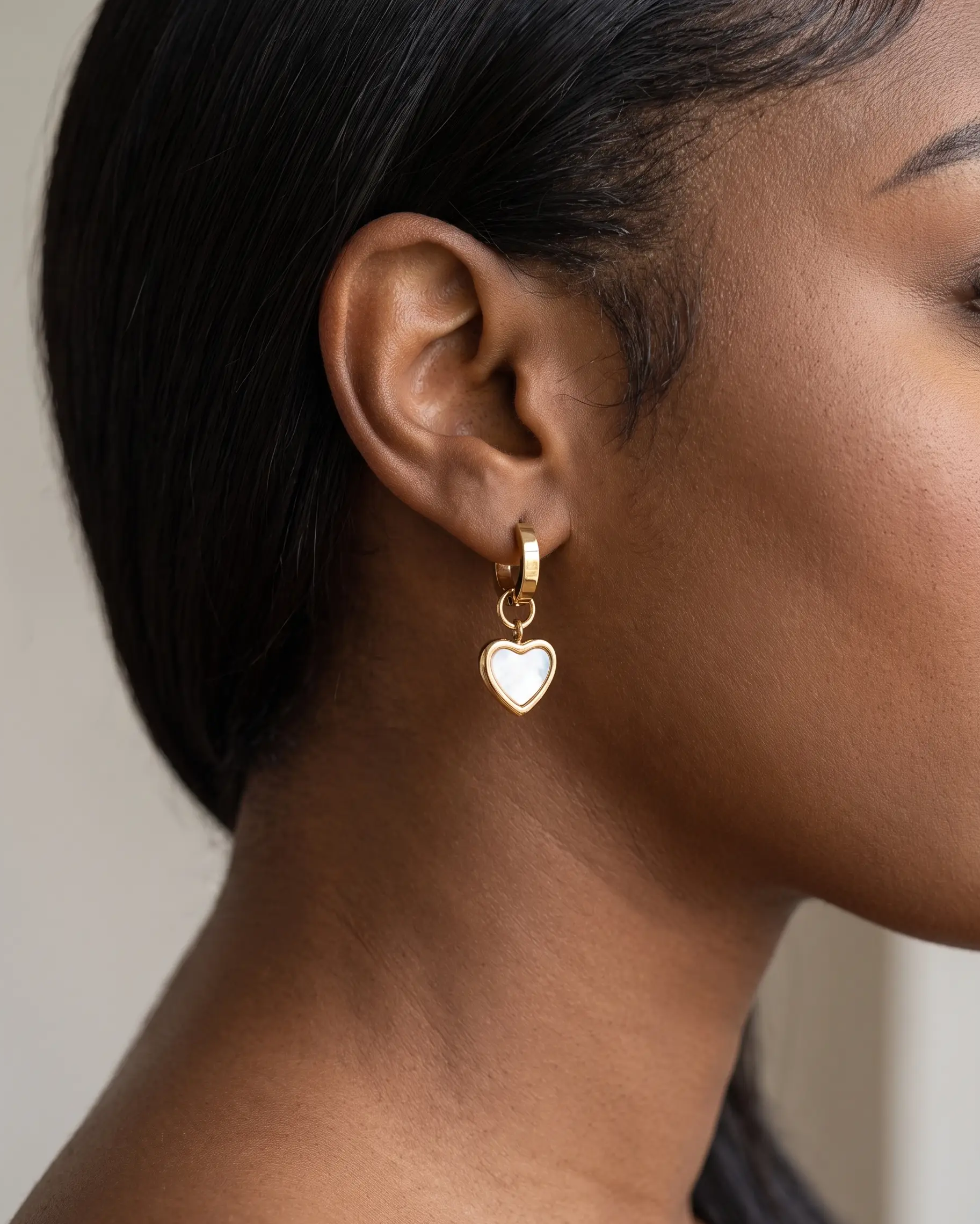 studio-ai earrings-selma-heart-huggies_studio2_a2+solo.png