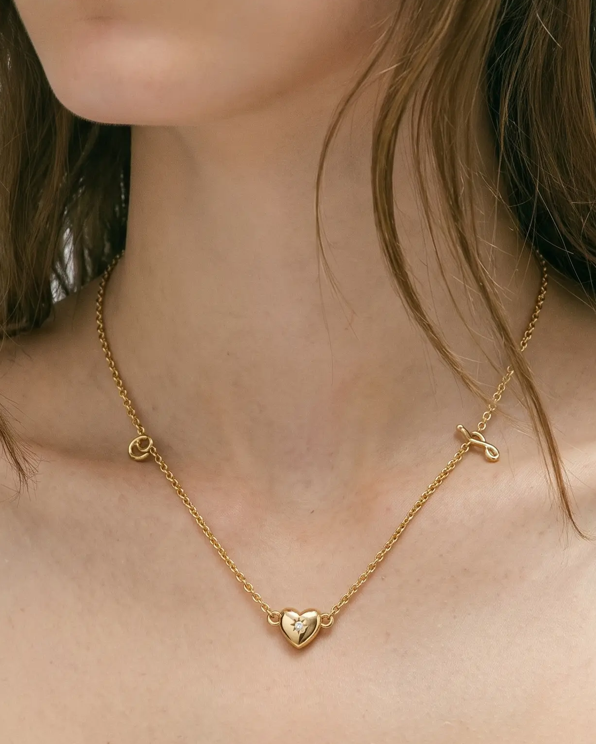 studio-ai necklace-fine-script-initial-necklace_lifestyle1_a1+solo.png