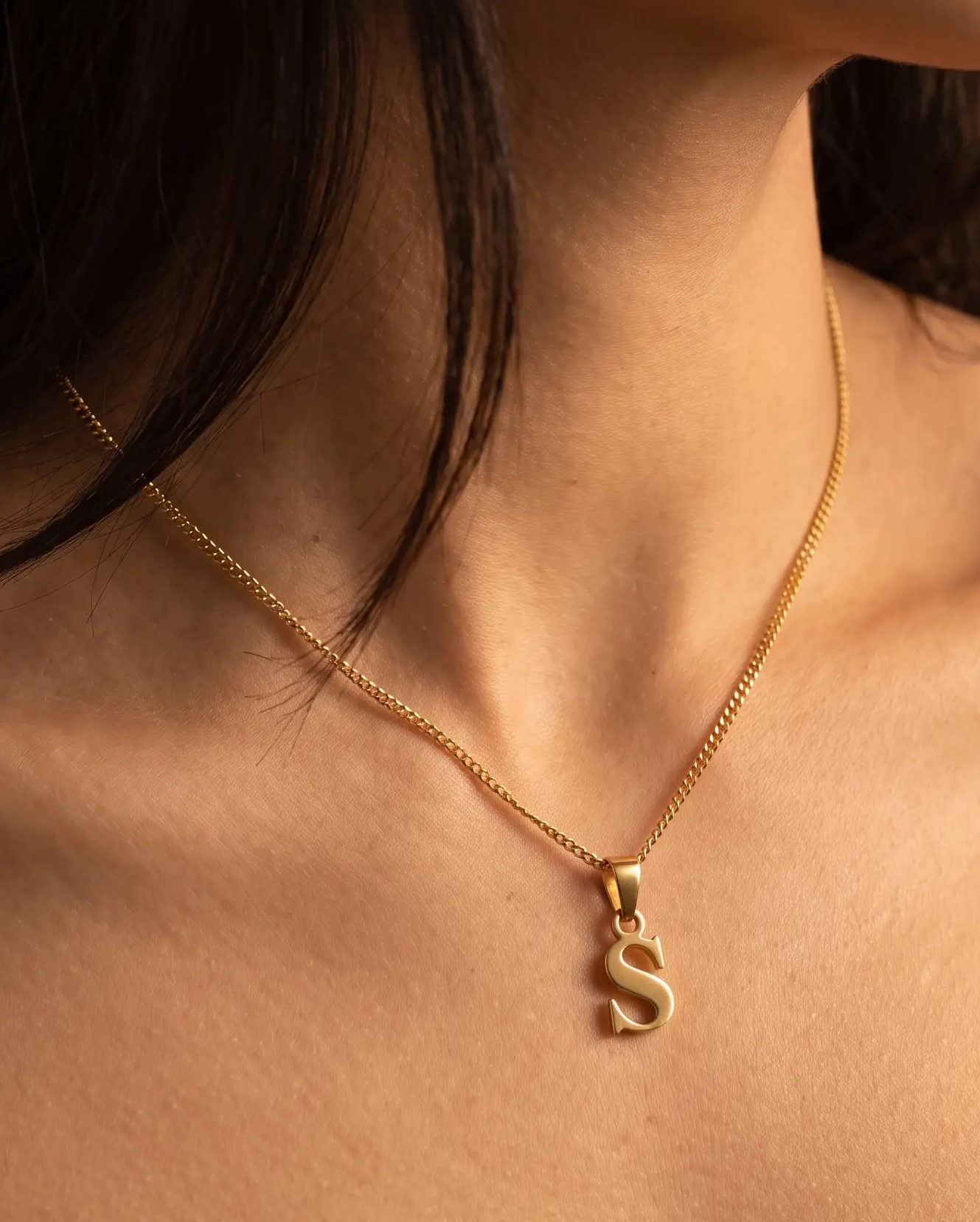 studio-ai necklace-gold-letter-charm-necklace_studio1_a1+solo.png