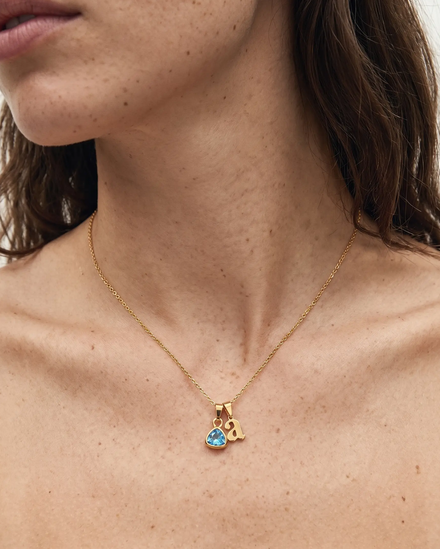 studio-ai necklace-heartfelt-initial-and-birthstone-necklace_studio2_a1+solo.png