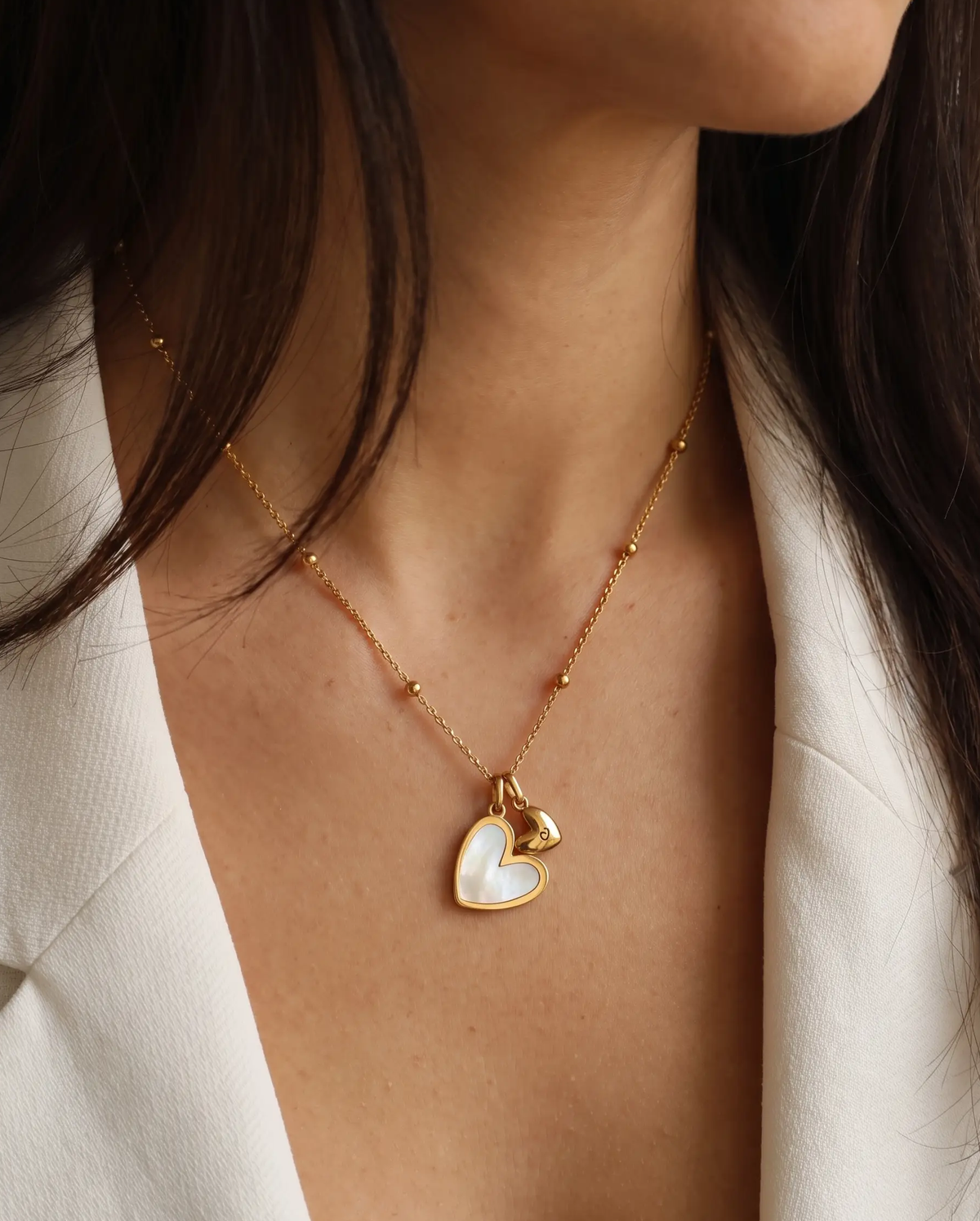 studio-ai necklace-initial-and-heart-pair-necklace_lifestyle1_a1+solo.png