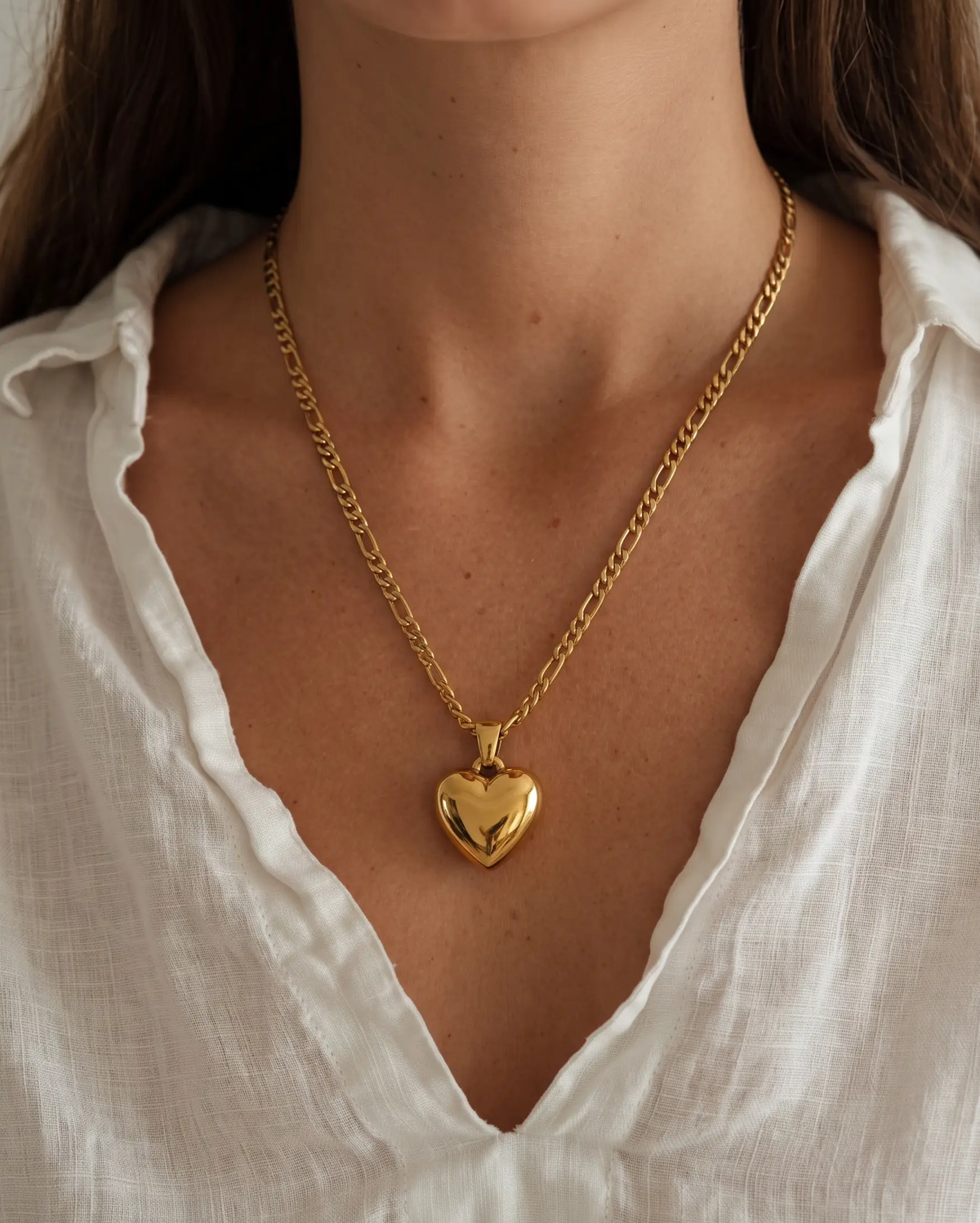 studio-ai necklace-puff-heart-pendant-necklace_lifestyle1_a1+solo.png