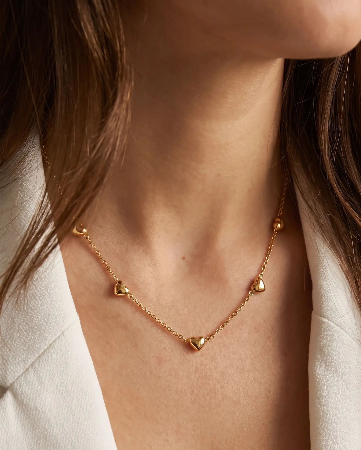 studio-ai necklace-puff-heart-station-necklace_lifestyle1_a1+solo.png