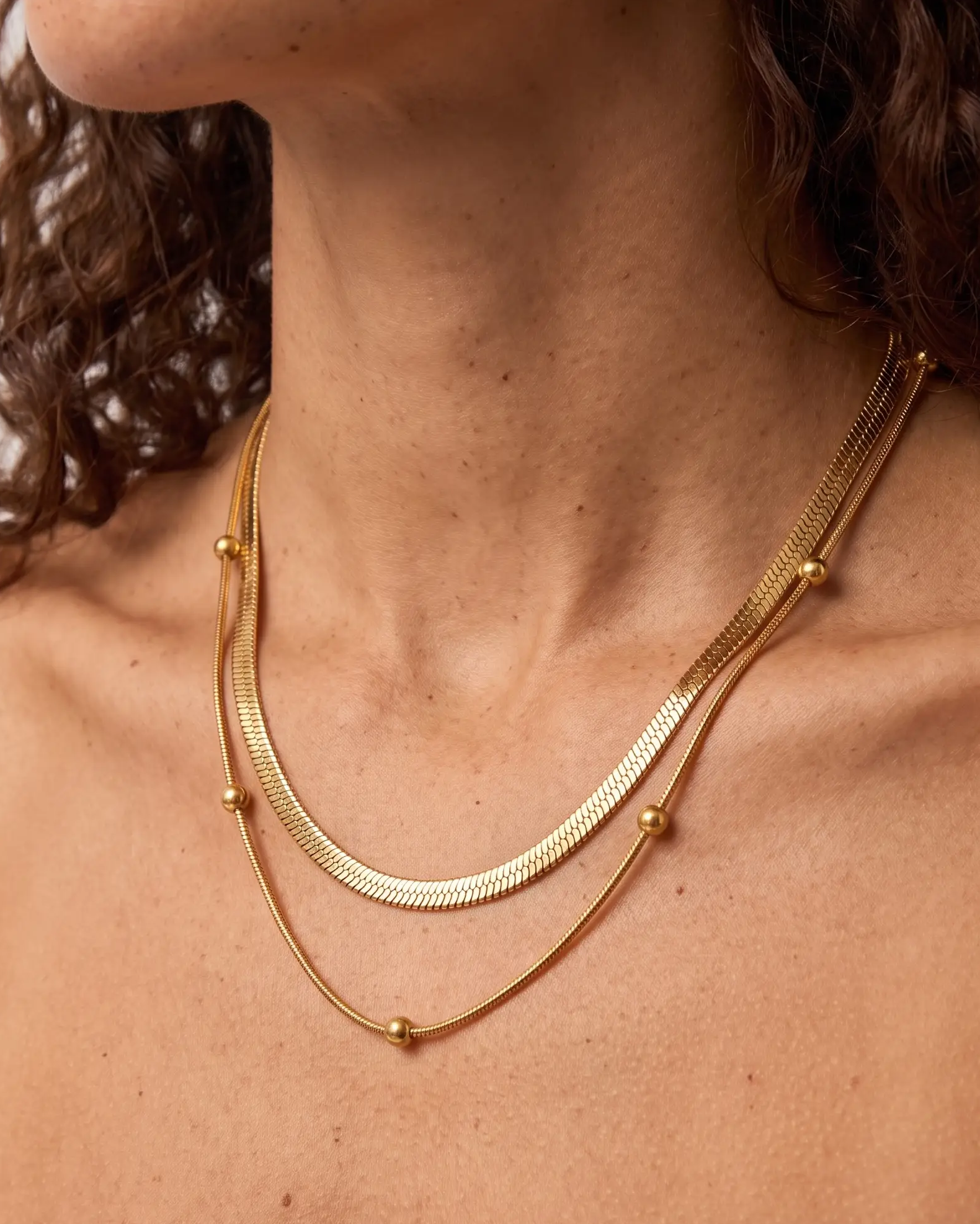 studio-ai necklace-snake-and-satellite-layered-necklace_lifestyle1_a1+solo.png
