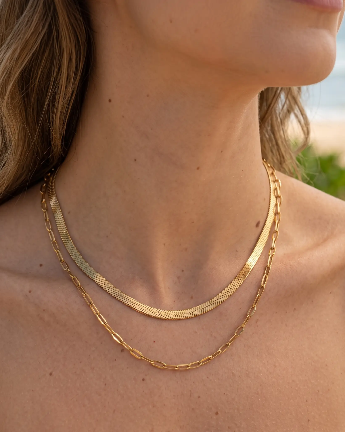 studio-ai necklace-snake-and-sequin-layered-necklace_lifestyle1_a1+solo.png