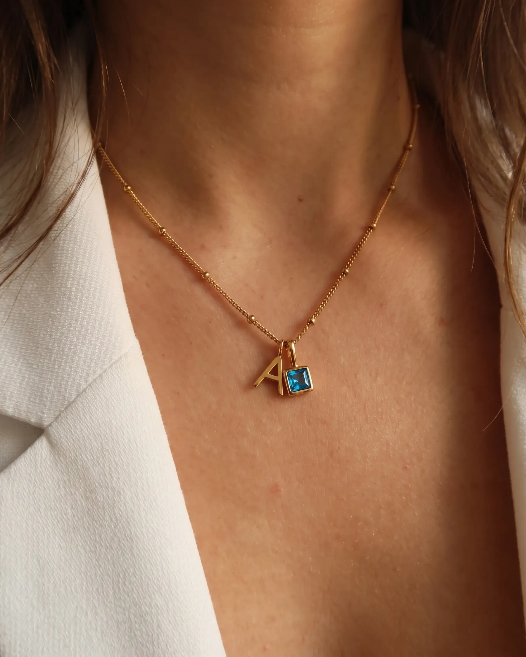 studio-ai necklace-stone-initial-necklace_studio2_a1+solo.png