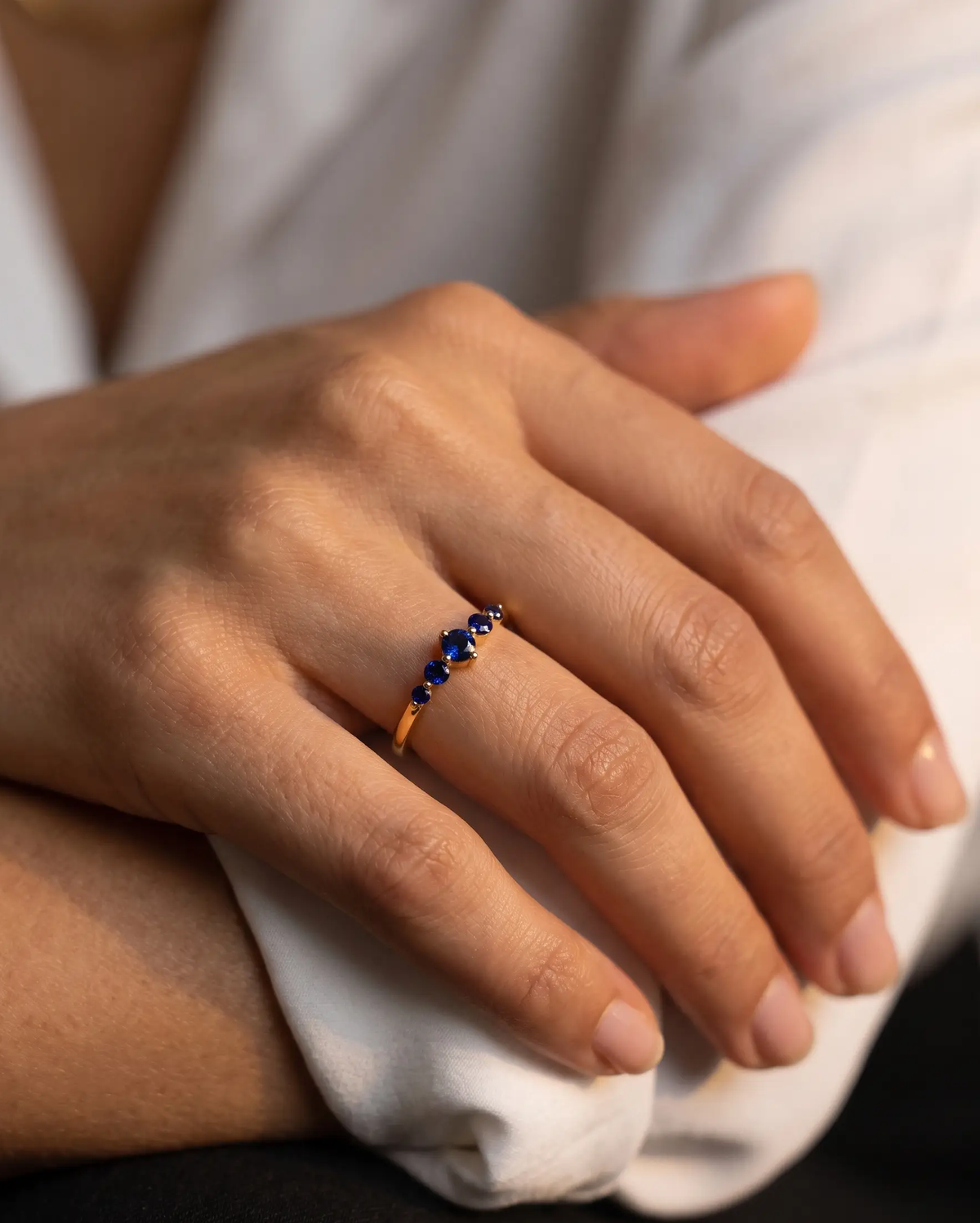 studio-ai ring-thea-stacking-birthstone-ring_lifestyle1_a1+solo.png
